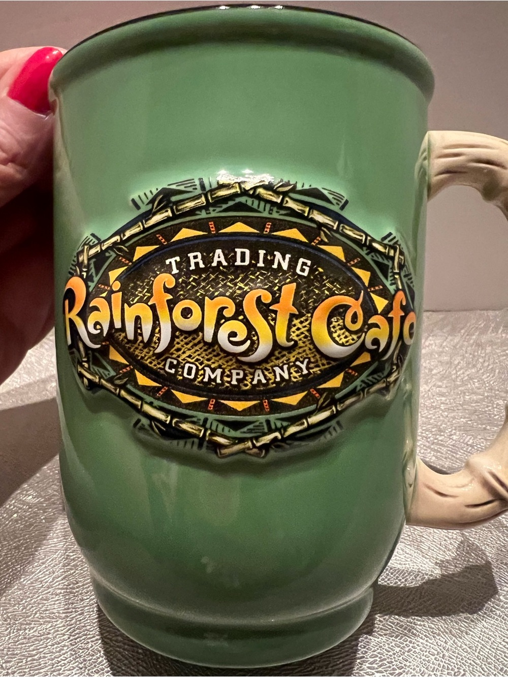 Rainforest Cafe 3D Logo Ceramic Coffee Mug Simulated Bamboo Handle 16 oz Green.